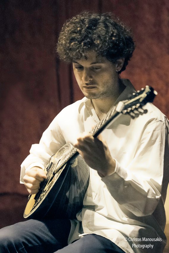 Image of Ptolemaios playing the Greek Bouzouki